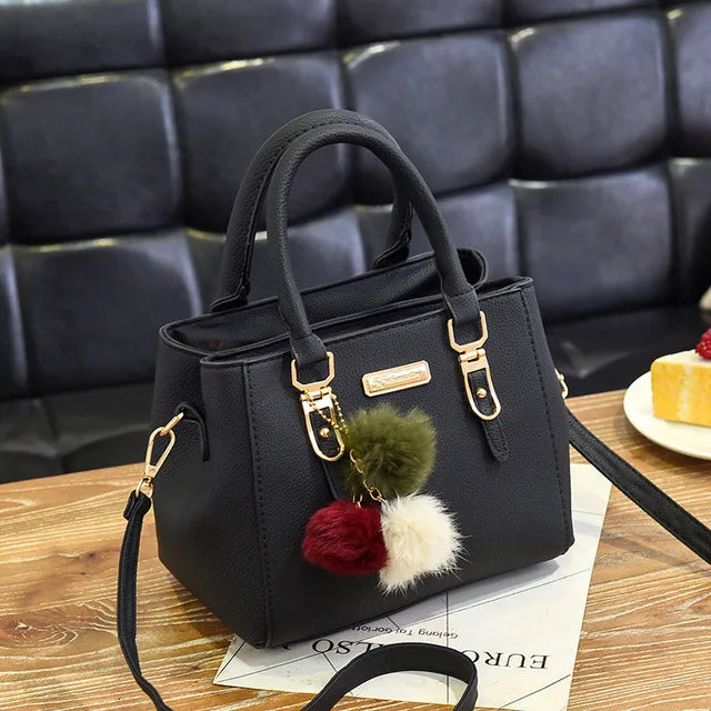 Bolsa feminina de mão com alça diversas cores. Serve para qualquer tipo de ocasião.