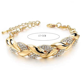 Pulseira feminina folheado a ouro com pedrinhas brilhantes de cristal.  Ajustável  no braço.